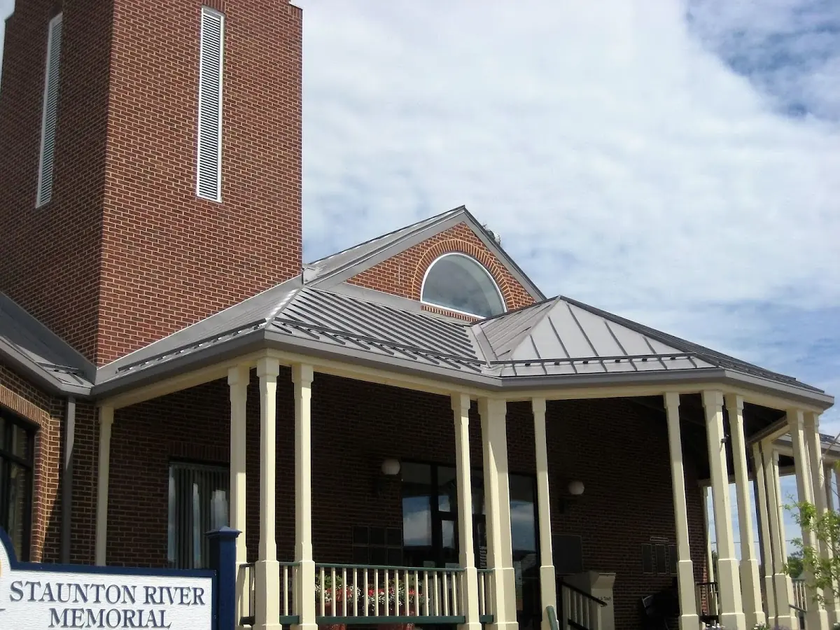 Skilled roofing craftsmen working on a residential roof in Richmond